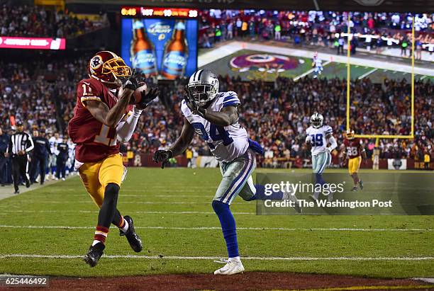 Washington Redskins wide receiver DeSean Jackson catches a touchdown pass over Dallas Cowboys cornerback Morris Claiborne during the fourth quarter...