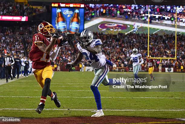 Washington Redskins wide receiver DeSean Jackson catches a touchdown pass over Dallas Cowboys cornerback Morris Claiborne during the fourth quarter...