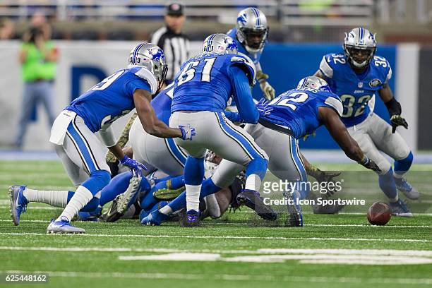 Detroit Lions linebacker Antwione Williams and his defensive teammates chase after a loose ball during game action between the Jacksonville Jaguars...