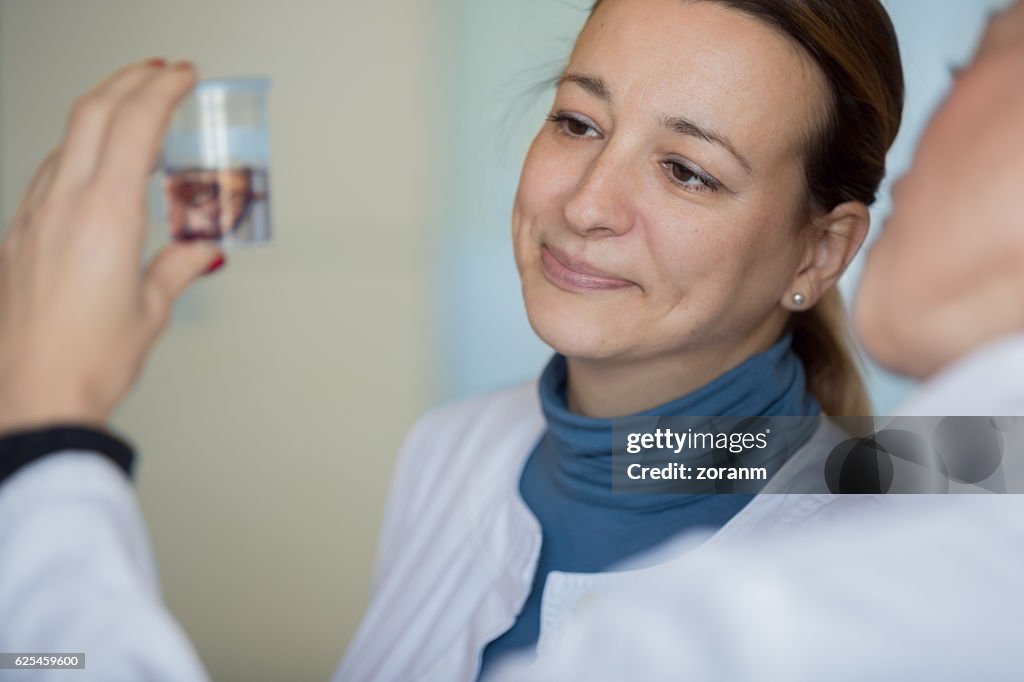 Biologist looking at specimen