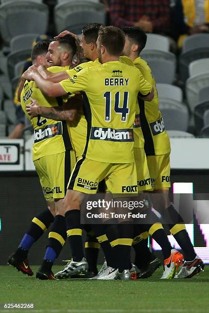 Roy O'Donovan of the Mariners celebrates a goal with team mates during the round eight A-League match between the Central Coast Mariners and the...