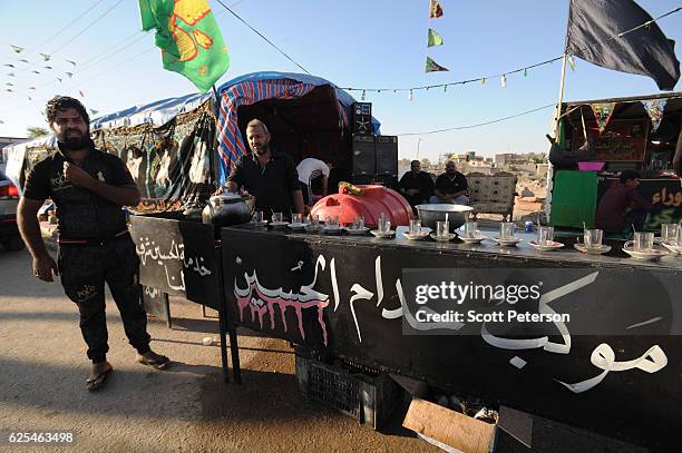 Men ready tea as Iraqi Shiites prepare the route for millions of pilgrims in the annual religious ritual of Arbaeen, which commemorates the 40th day...