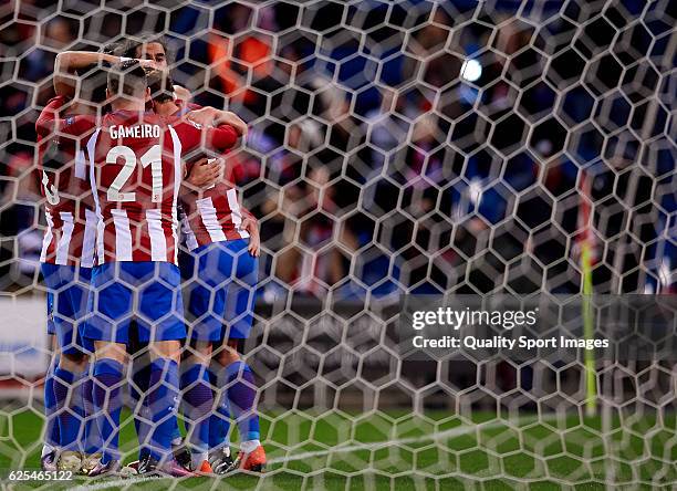 Kevin Gameiro of Atletico de Madrid celebrates with his teammates during the UEFA Champions League Group D match between Club Atletico de Madrid and...