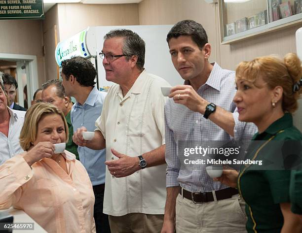 During a campaign stop, American politician and Congressman Paul Ryan drinks coffee behind the counter at the Versailles restaurant in the Little...