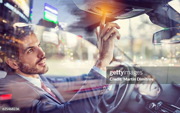 man in car using the car assistance button - graphic car accidents stock pictures, royalty-free photos & images