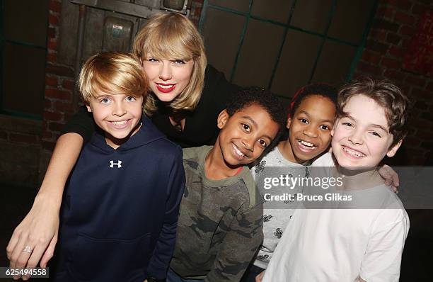 Jake Katzman, Taylor Swift, Devin Trey Campbell, Jesus Del Orden and Christopher Convery pose backstage with the cast at the hit musical "Kinky...