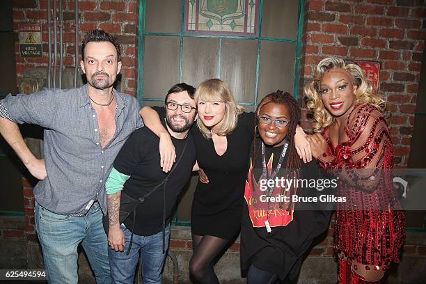 Taylor Swift poses with Todrick Hall as "Lola" and his "glam team" backstage with the cast at the hit musical "Kinky Boots" on Broadway at The Al...