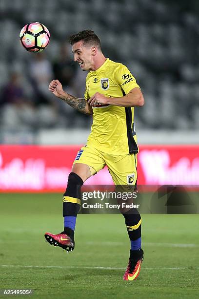Storm Roux of the Mariners heads the ball during the round eight A-League match between the Central Coast Mariners and the Perth Glory at Central...