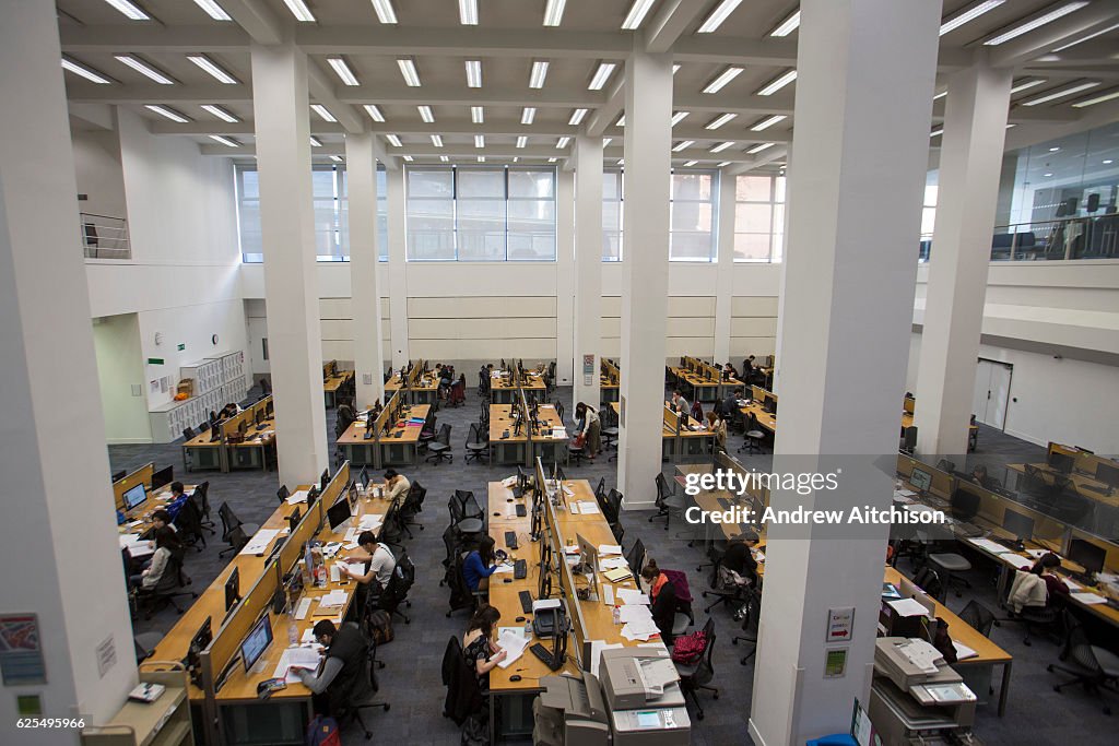 Lse Workspace Students studying at hot desks inside the main LSE library designed ...