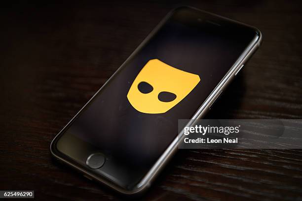 The "Grindr" app logo is seen on a mobile phone screen on November 24, 2016 in London, England. Following a number of deaths linked to the use of...