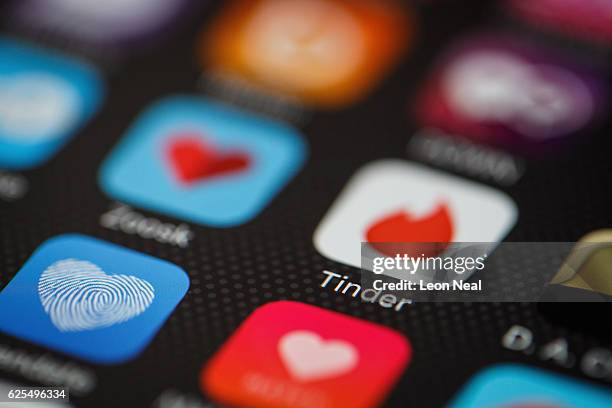 The "Tinder" app logo is seen amongst other dating apps on a mobile phone screen on November 24, 2016 in London, England. Following a number of...