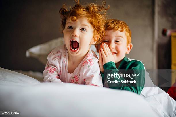 morning silliness - sibling stock pictures, royalty-free photos & images