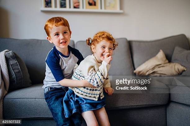 siblings playing at home - brother sister stock pictures, royalty-free photos & images