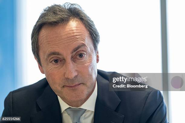 Fabrice Bregier, chief executive officer of the commercial aircraft unit at Airbus Group, pauses during a news conference as an A350-1000 twinjet...