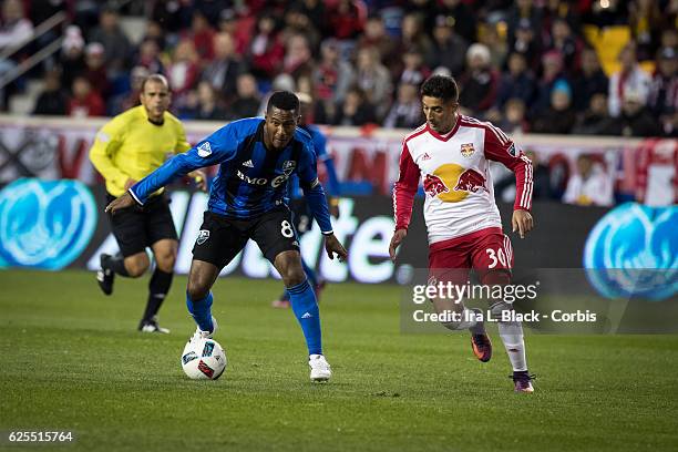 Midfielder and Captain Patrice Bernier of the Montreal Impact drives against Red Bulls player Gonzalo Veron during the second leg of the 2016 MLS...