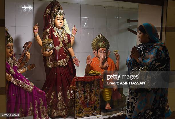 Pakistani Hindus prays at a temple in Karachi on November 24, 2016. A Pakistan province passed a law making "forced conversions" punishable with a...