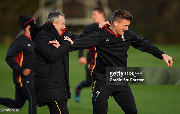 Wales coach Robert Howley shares a joke with centre Jonathan Davies during Wales training ahead of their match against South Africa at the Vale on...
