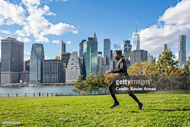 healthy young african man running in park - central park bildbanksfoton och bilder