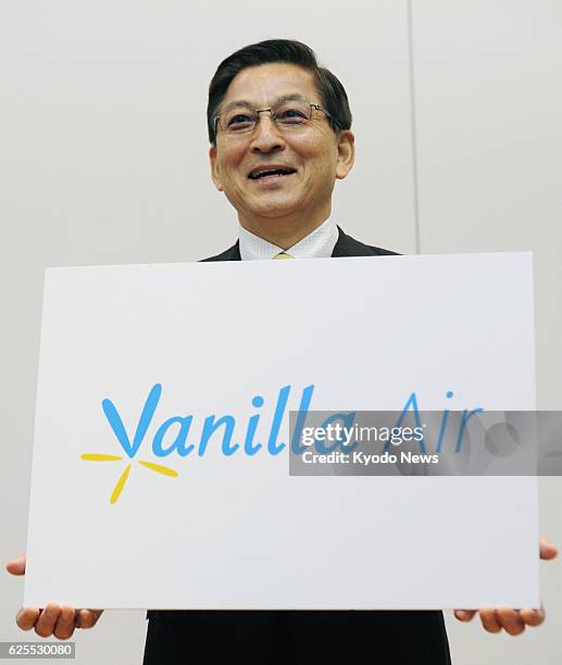 Japan - Tomonori Ishii, president of budget airline AirAsia Japan, unveils the company's new name, Vanilla Air, at a news conference in Tokyo on Aug....