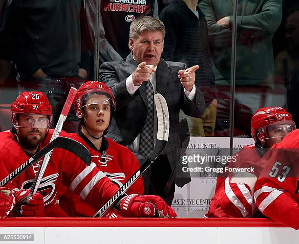 Head coach Bill Peters of the Carolina Hurricanes directs players from the bench area during an NHL game against the Montreal Canadiens on November...