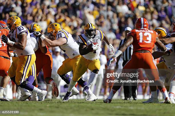 Leonard Fournette of the LSU Tigers runs with the ball during a game against the Florida Gators at Tiger Stadium on November 19, 2016 in Baton Rouge,...