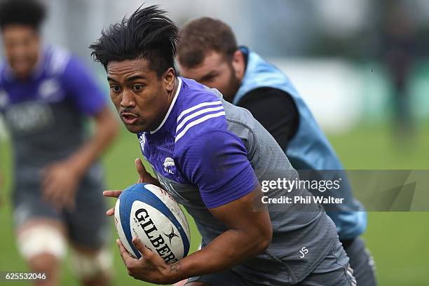 Julian Savea of the New Zealand All Blacks breaks away during a training session at the Suresnois Rugby Club on November 24, 2016 in Paris, France.