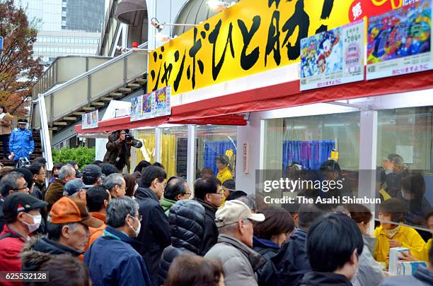 People queue to purchase the Year-End Jumbo Lottery on November 24, 2016 in Osaka, Japan.