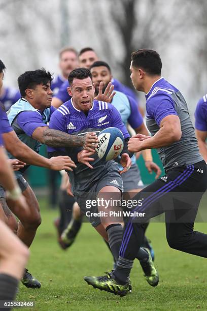 Ryan Crotty of the New Zealand All Blacks runs with the ball during a training session at the Suresnois Rugby Club on November 24, 2016 in Paris,...