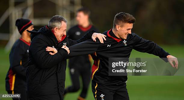 Wales coach Robert Howley shares a joke with centre Jonathan Davies during Wales training ahead of their match against South Africa at the Vale on...