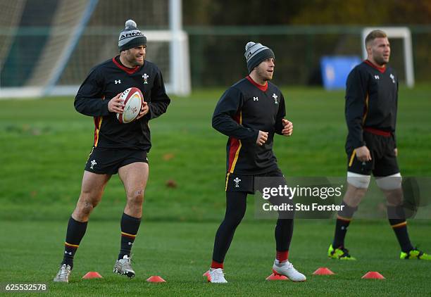 Wales players from left to right Jamie Roberts, Gareth Davies and Ross Moriarty in action during Wales training ahead of their match against South...