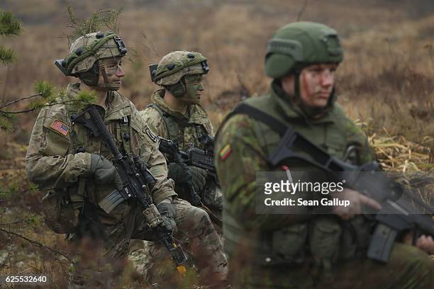 Members of the U.S. 173rd Airborne Brigade and a Lithuanian infantry soldier participate in the Iron Sword multinational military exercises on...