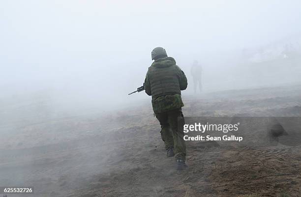 Lithuanian infantry soldiers participate in the Iron Sword multinational military exercises on November 24, 2016 near Pabrade, Lithuania....