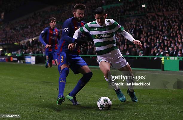 Gerard Pique of Barcelona vies with Tom Rogic of Celtic during the UEFA Champions League match between Celtic FC and FC Barcelona at Celtic Park...