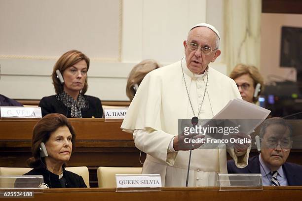 Pope Francis flanked by Queen Silvia of Sweden, holds hia speech during the 'Narcotics: Problems and Solutions of this Global Issue' seminar at the...