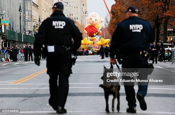 Officers patrol the street as people arrive to watch the 90th Macy's Annual Thanksgiving Day Parade on November 24, 2016 in New York City. Security...