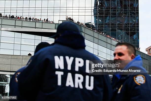 Officers stand guard as people try to watch the 90th Macy's Annual Thanksgiving Day Parade on November 24, 2016 in New York City. Security was tight...