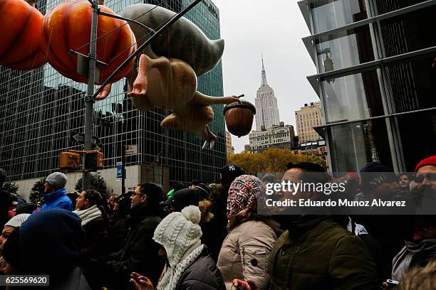 People watch the 90th Macy's Annual Thanksgiving Day Parade on November 24, 2016 in New York City. Security was tight in New York City on Thursday...