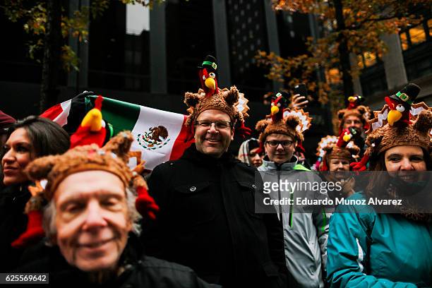 People watch the 90th Macy's Annual Thanksgiving Day Parade on November 24, 2016 in New York City. Security was tight in New York City on Thursday...