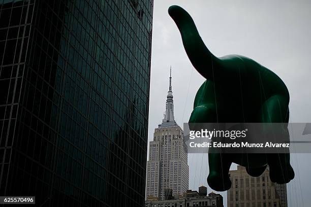 The Dino balloon floats down 6th Av, during the 90th Macy's Annual Thanksgiving Day Parade on November 24, 2016 in New York City. Security was tight...