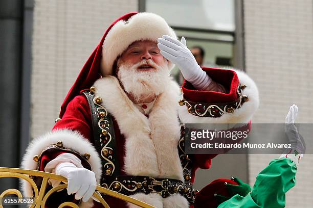 Person dressed as Santa Claus waves from a float during the 90th Macy's Annual Thanksgiving Day Parade on November 24, 2016 in New York City....