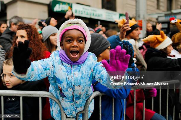 People watch the 90th Macy's Annual Thanksgiving Day Parade on November 24, 2016 in New York City. Security was tight in New York City on Thursday...