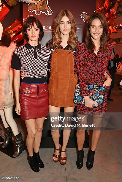 Sam Rollinson, Eve Delf and Charlotte Wiggins attend the launch of Coach House Regent Street on November 24, 2016 in London, England.