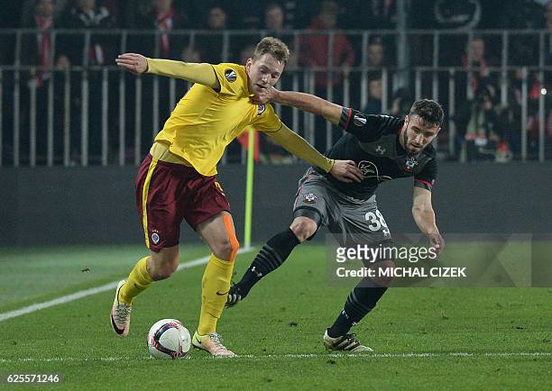 Sparta Prague's Czech striker Lukas Julis and Southampton's English midfielder Sam McQueen vie for tha ball duding the UEFA Europa League group K...