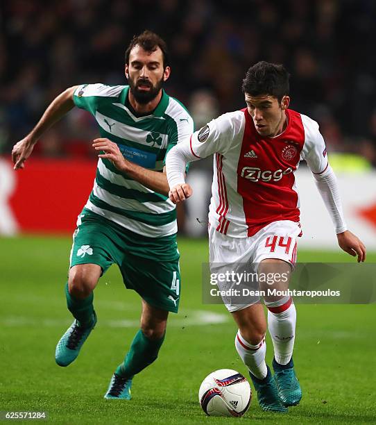 Clement of Ajax evades Giorgios Koutroubis of Panathinaikos during the UEFA Europa League Group G match between AFC Ajax and Panathinaikos FC at...