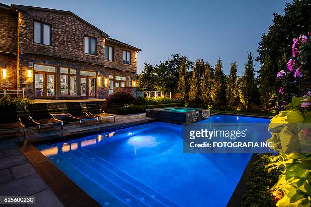 toronto villa outside - swimming pool night stock pictures, royalty-free photos & images