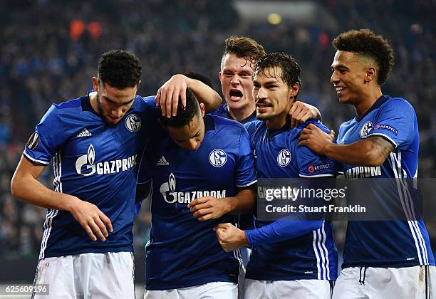 Dennis Aogo of Schalke celebrates with team mats as he scores their second goal from a penalty during the UEFA Europa League Group I match between FC...