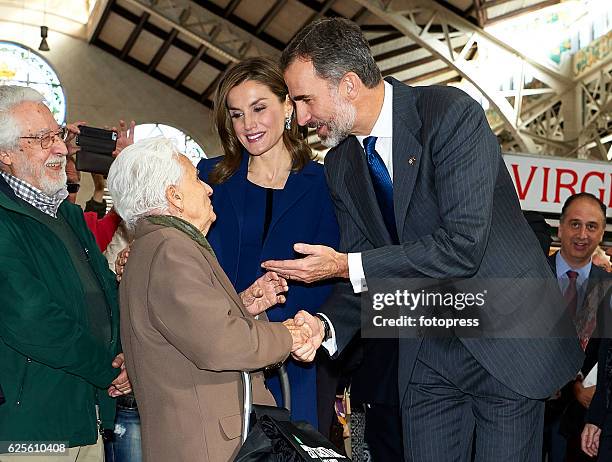 King Felipe VI of Spain and Queen Letizia of Spain visit the central market after the 'Rey Jaime I Awards' at Lonja de los Mercaderes on November 24,...