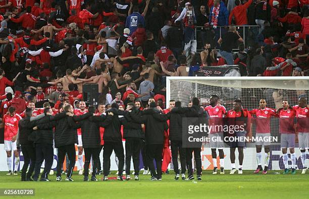 Hapoel's players celebrate after winning the UEFA Europa League group K football match between Israel's Hapoel Beer Sheva and Italy's Inter Milan on...