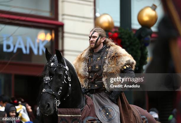 People attend the 83rd Annual Thanksgiving Day Parade at State Street in Chicago, Illinois on November 24, 2016. The parade featured marching bands...