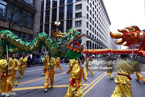 People attend the 83rd Annual Thanksgiving Day Parade at State Street in Chicago, Illinois on November 24, 2016. The parade featured marching bands...